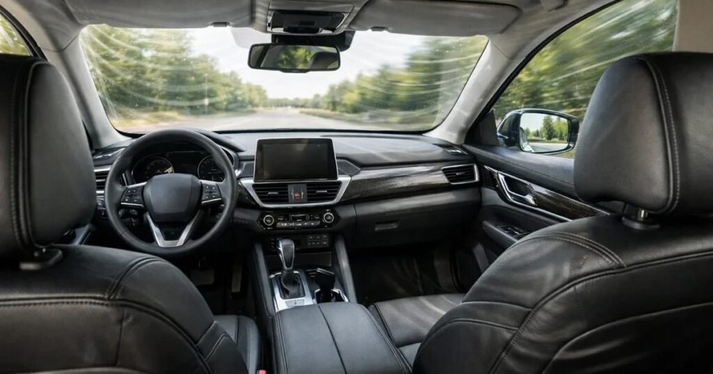 The inside of a vehicle with a view as if you are sitting in the rear left seat